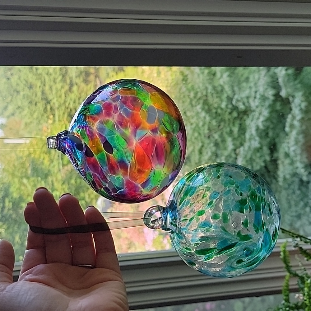 TWO calico glass ornaments